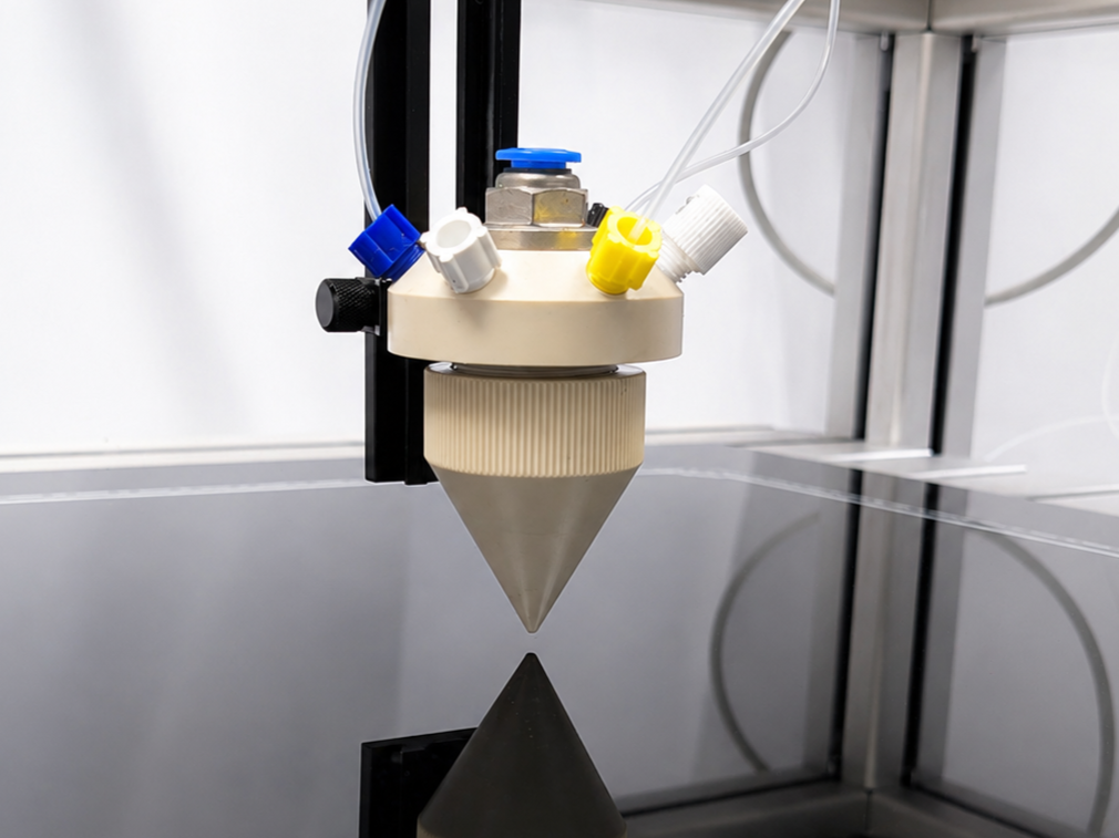 Spray coeater for uniform sample preparation